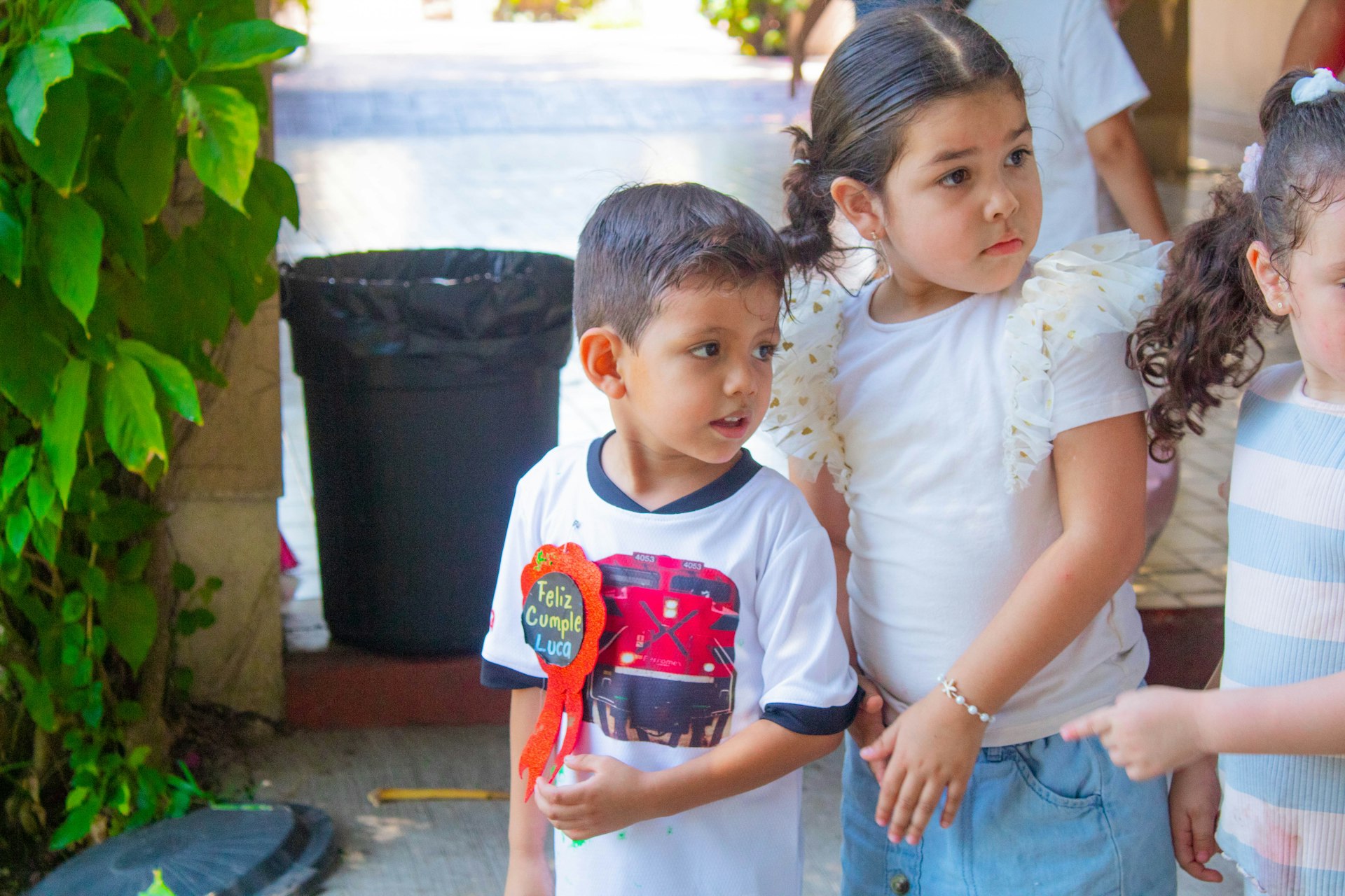 a group of young children standing next to each other